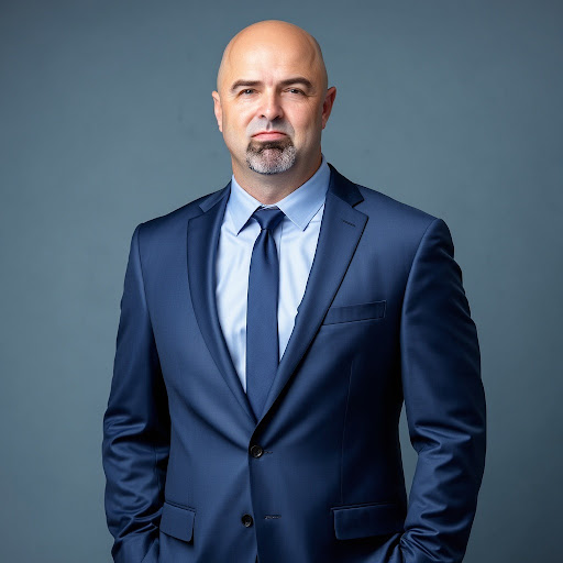 Professional headshot of Jim Rand, founder of Qualcosa Group